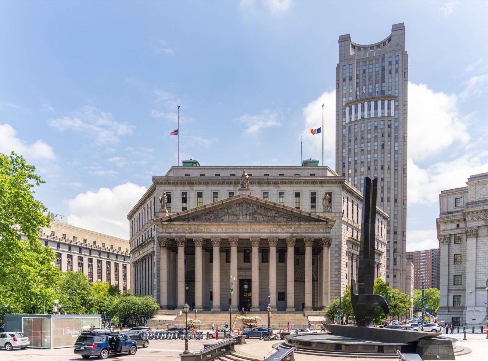 An Austrian regional court building seen from the street on a working weekday morning.