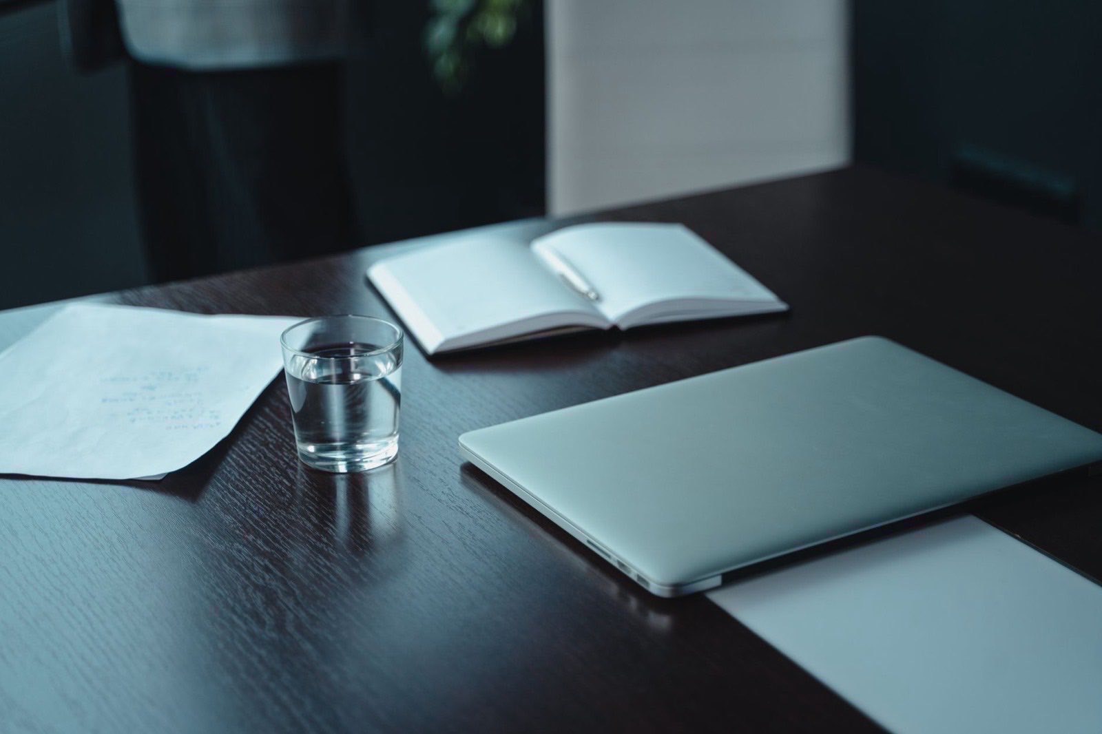 A company file and a blank tax registration questionnaire on a desk.