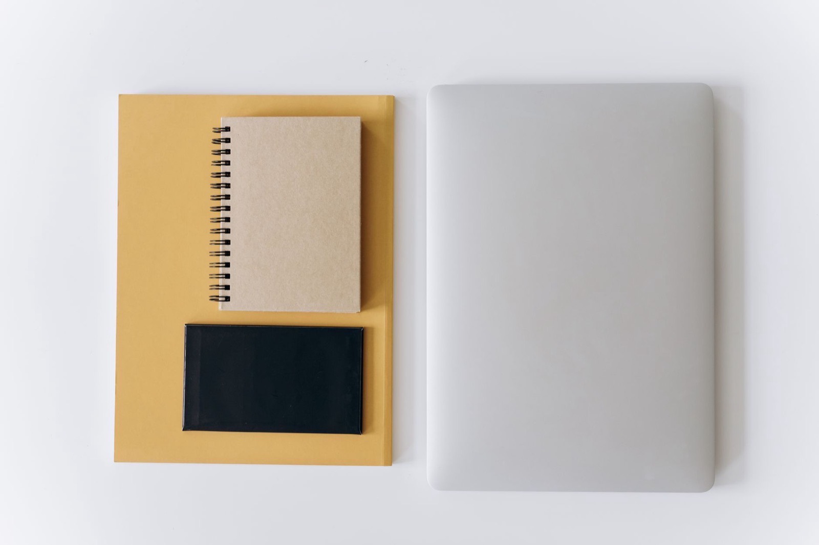 A desk diary lying at an angle on a plain surface.